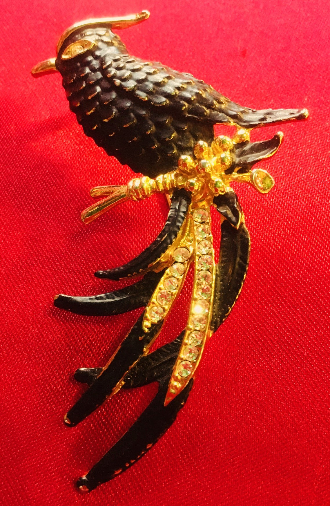 Vintage black and gold coloured Bird brooch with diamanté inlay